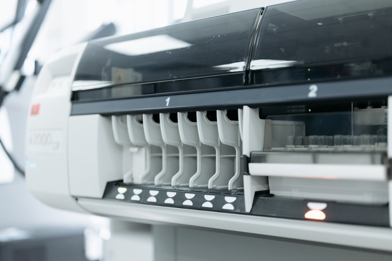 A close-up of advanced laboratory testing equipment used for medical and scientific research in a sterile environment.
