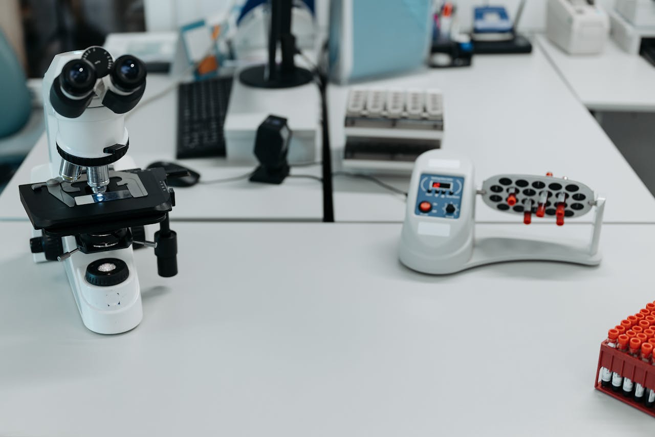 A well-equipped laboratory with a microscope and vials ready for analysis.